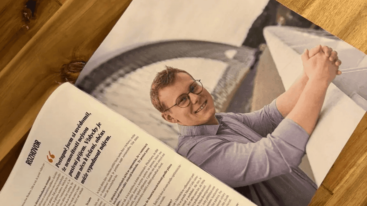 The Rentiér interview spread open on a kitchen table — a full-page photo of Dennis Vymer next to the pull quote about real estate not being passive income